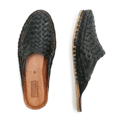 Handwoven black leather slides by Mohinders Shoes made in India in an ethical environment. Every pair is dyed by hand in a simple process using water + iron. 