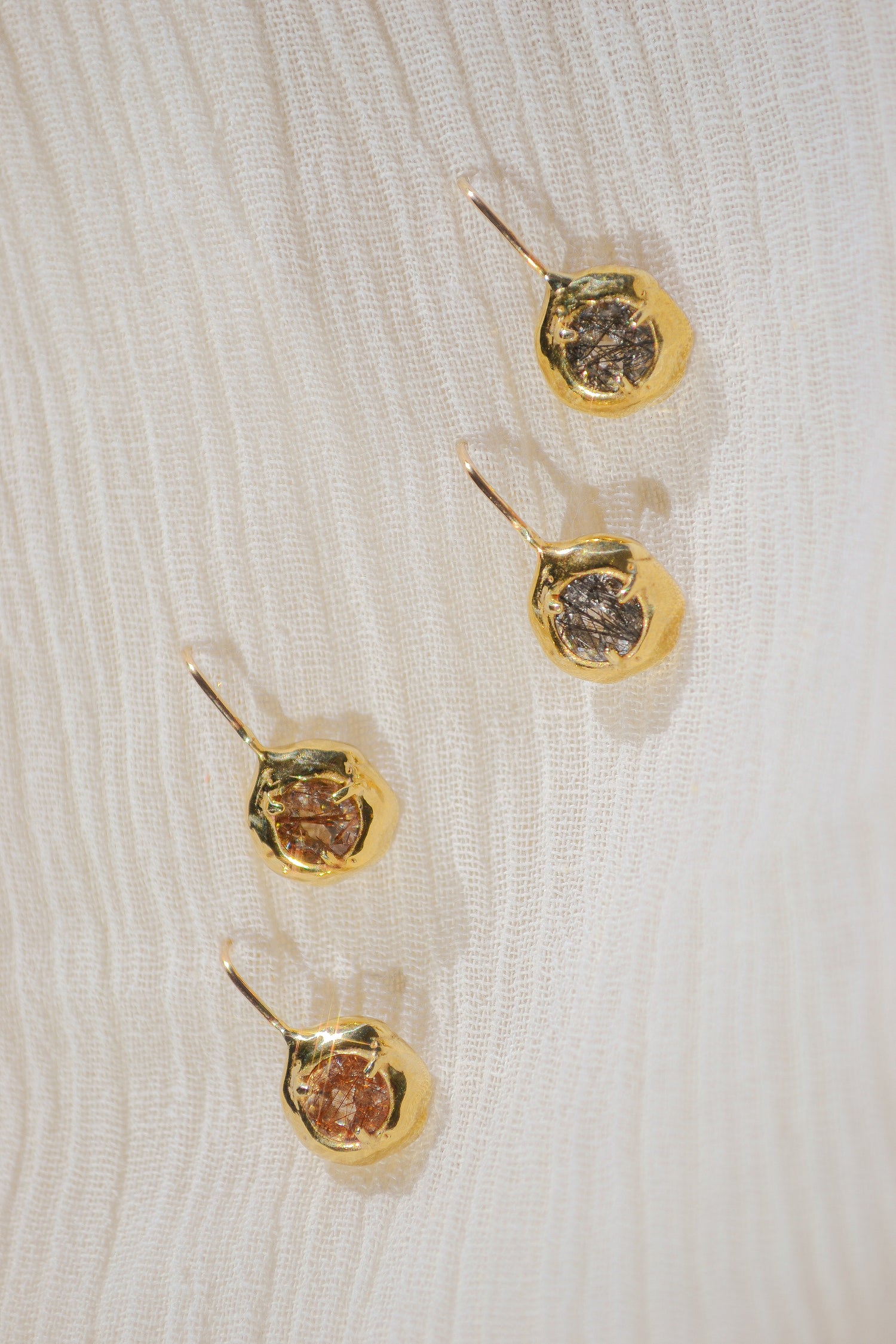 Delicate quartz pendant earrings handmade in northern California by Amanda Hunt. Keep the energy of quartz close to you.