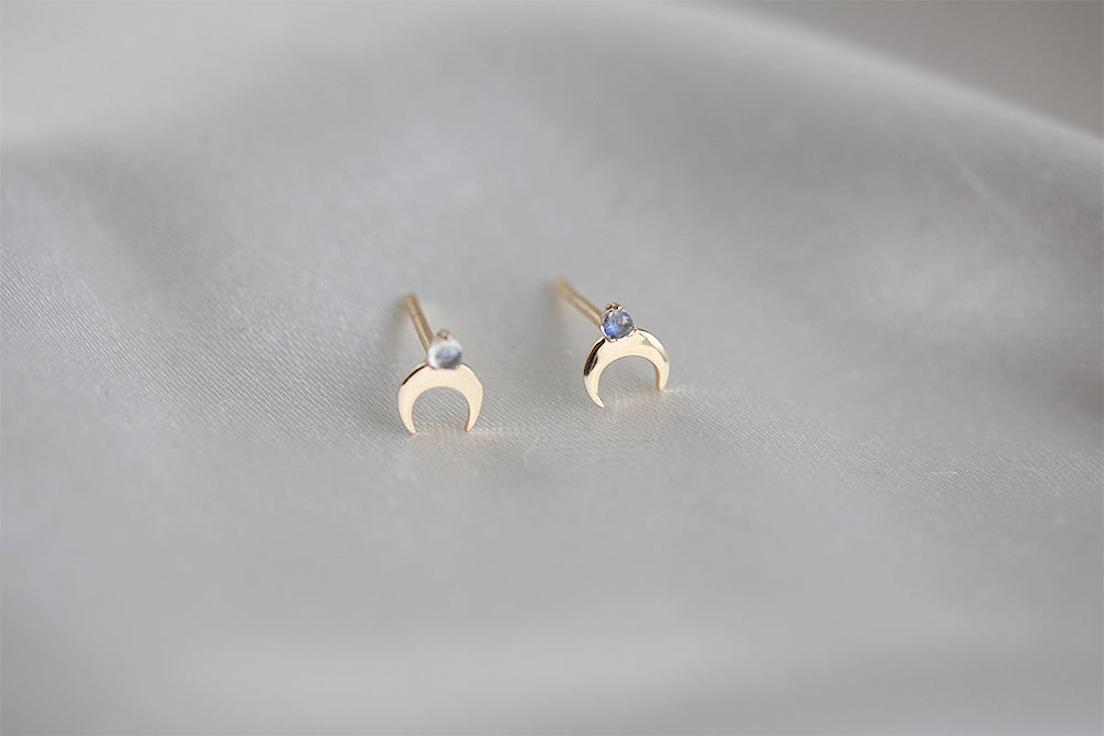 For night sky lovers.  A sparkling moonstone 'star' crowns golden crescent moon studs.  Details 2mm Rainbow Moonstone Approximately 6mm height Gold Vermeil 