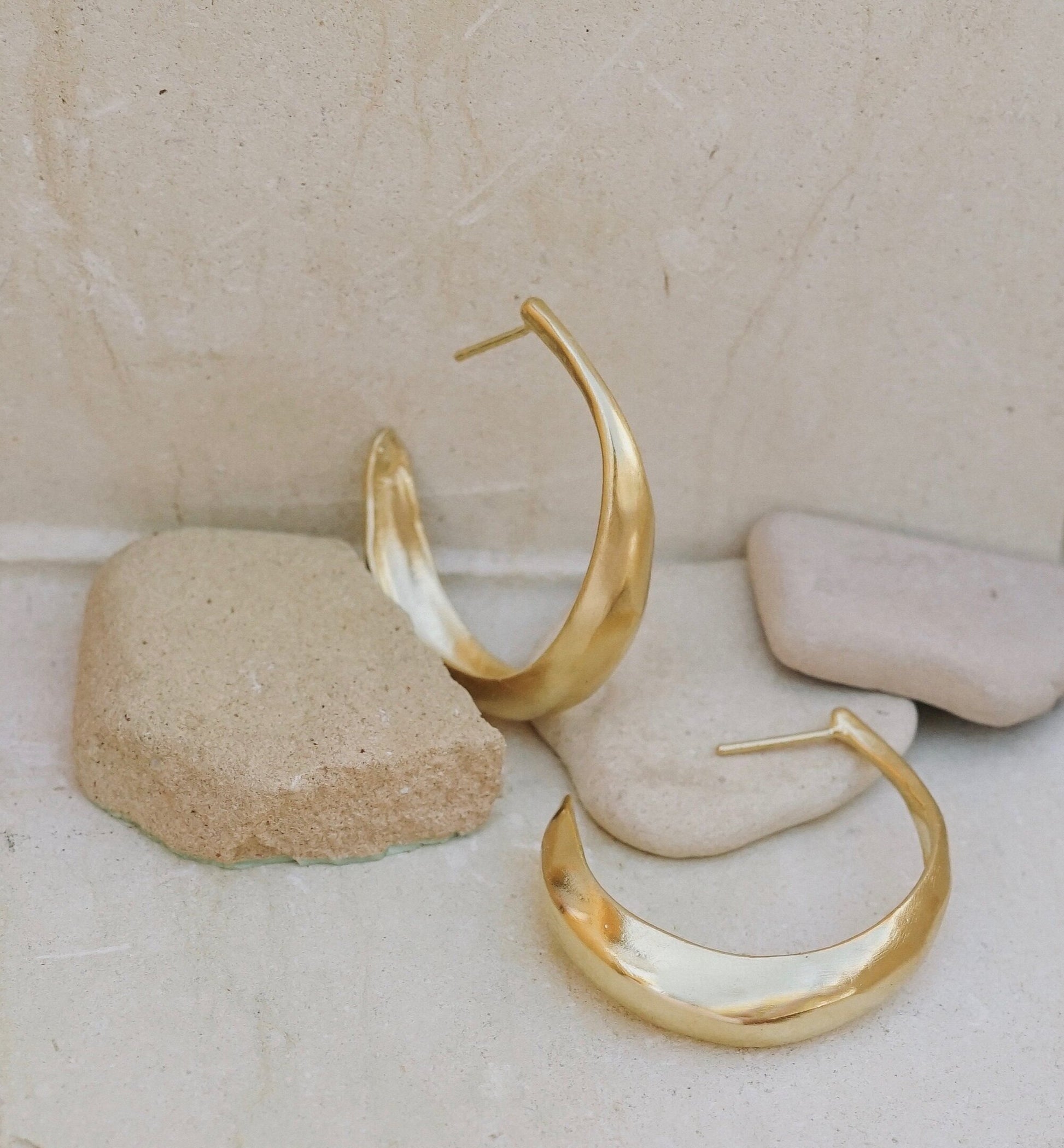 Textured organic simple light weight hoop earrings. This pair can be worn daily for a feminine, sculptural and elegant classic style. Earrings are made of recycled brass with sterling silver studs coated in a thick layer of high grade 14k gold. Handmade in the Santa Cruz Mountains.