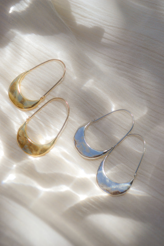 The Muse Hoops handmade with sterling silver by Amanda Hunt in Northern California. Elegant hoop earrings honoring the female form. Simple hook closure at back for continuous loop