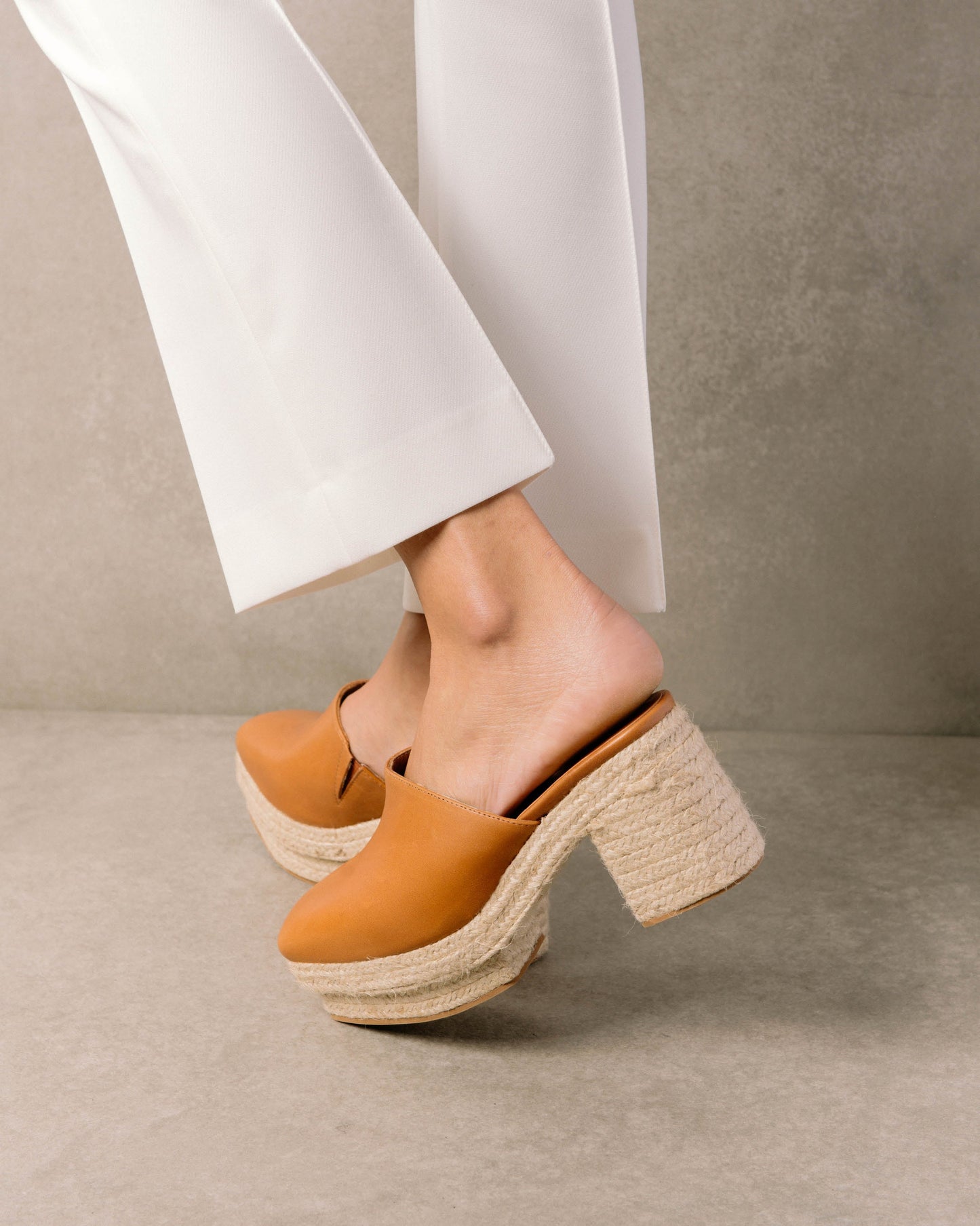 Clog style leather espadrilles with a closed toe and a sultry summer heel. Sustainably made in Spain.