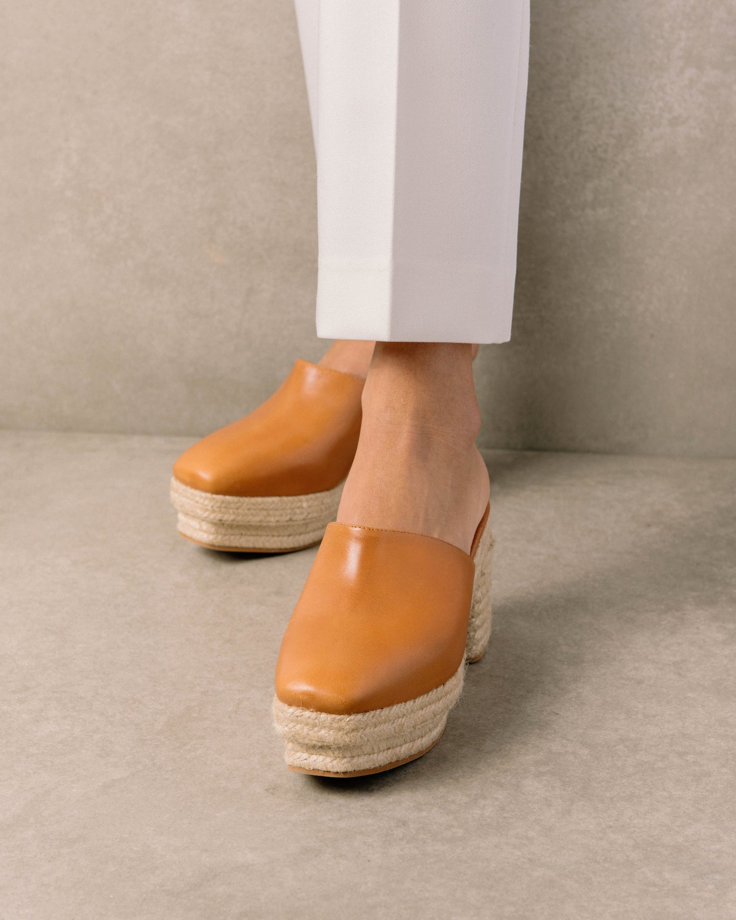 Clog style leather espadrilles with a closed toe and a sultry summer heel. Sustainably made in Spain.
