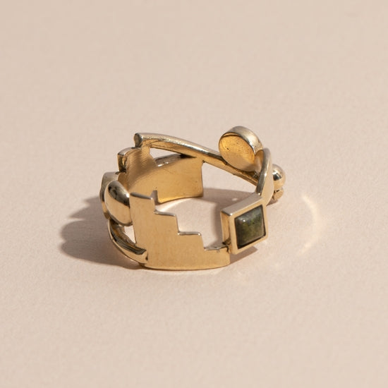 Brass Shapes ring features a collection of circle and square unakite stones wrapped around metallic semi-circle, rectangle and bar shapes. Handmade by Lindsay Lewis in Chicago, Illinois.
