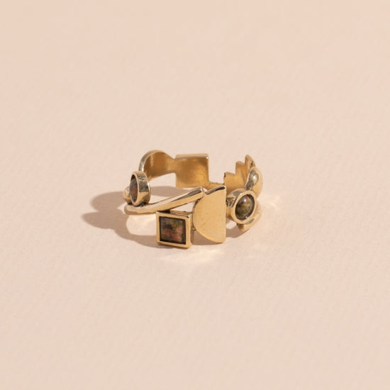 Brass Shapes ring features a collection of circle and square unakite stones wrapped around metallic semi-circle, rectangle and bar shapes. Handmade by Lindsay Lewis in Chicago, Illinois.