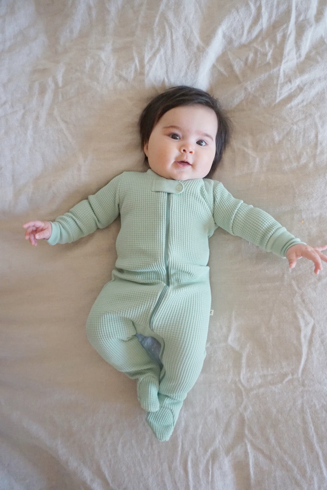 The Waffle Sleeper is made with the softest organic Pima Cotton and eco-friendly dye. The fabric is heavy enough to keep babies warm but is naturally designed to allow heat to escape off the baby's body.