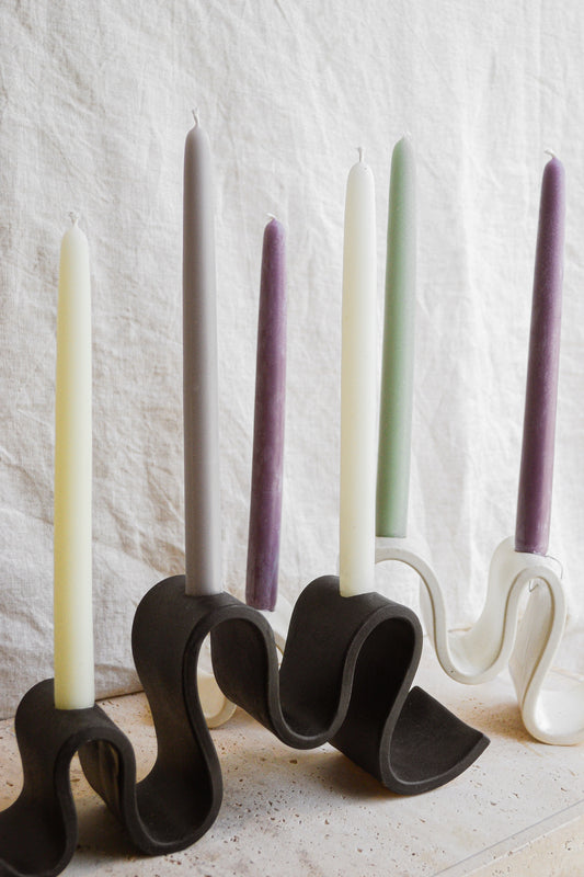 Meet Wyat: A stoneware candelabra with indulgent waves that support candlelight glow for every joyous dance party or intimate conversation over dinner. Handmade in Brooklyn, NY.